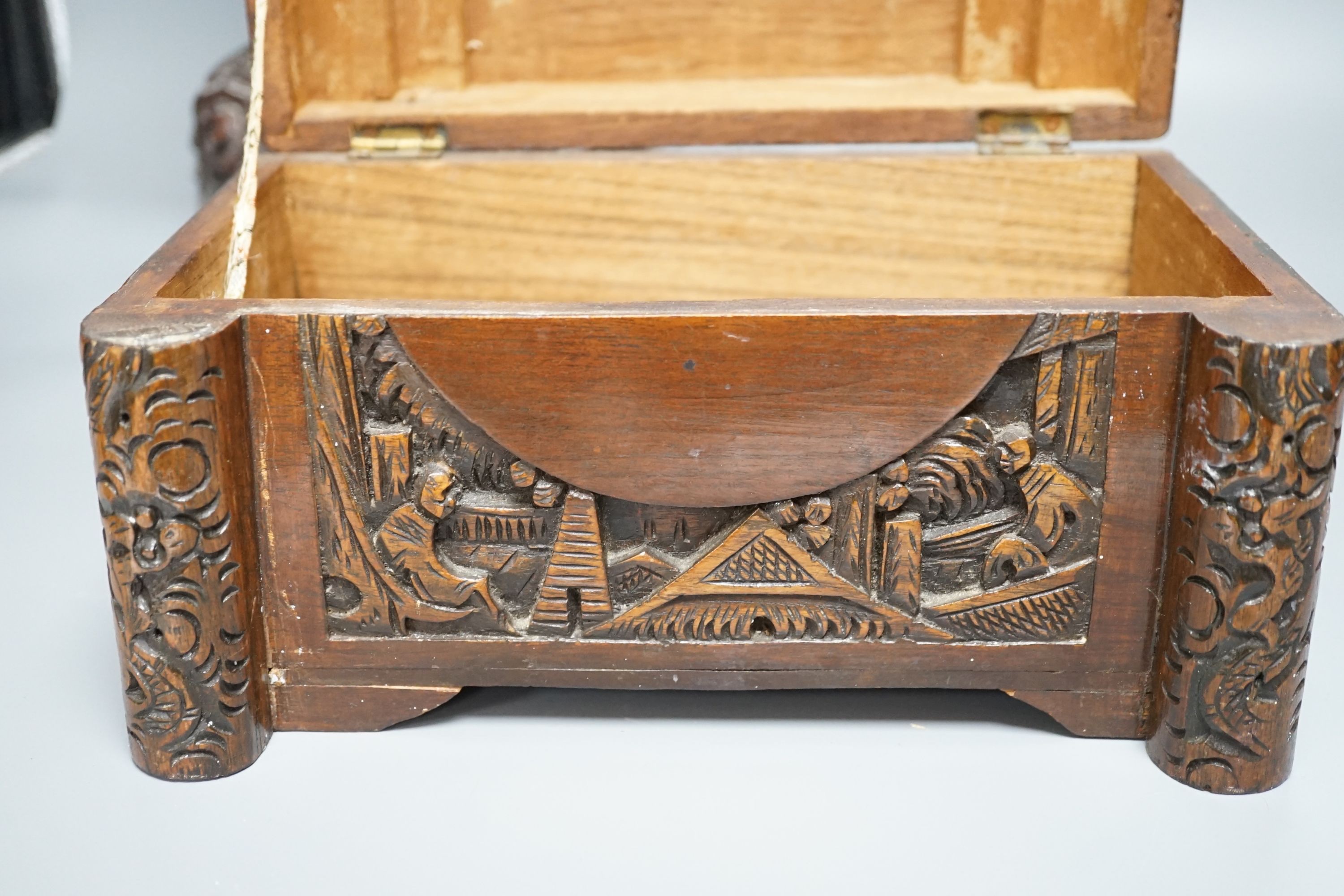 A Chinese carved wood sage and small carved trunk, Sage 47 cms high.